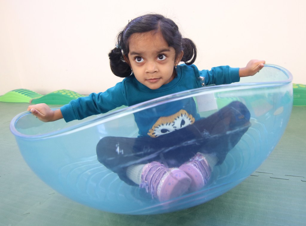 girl in plastic bowl toy